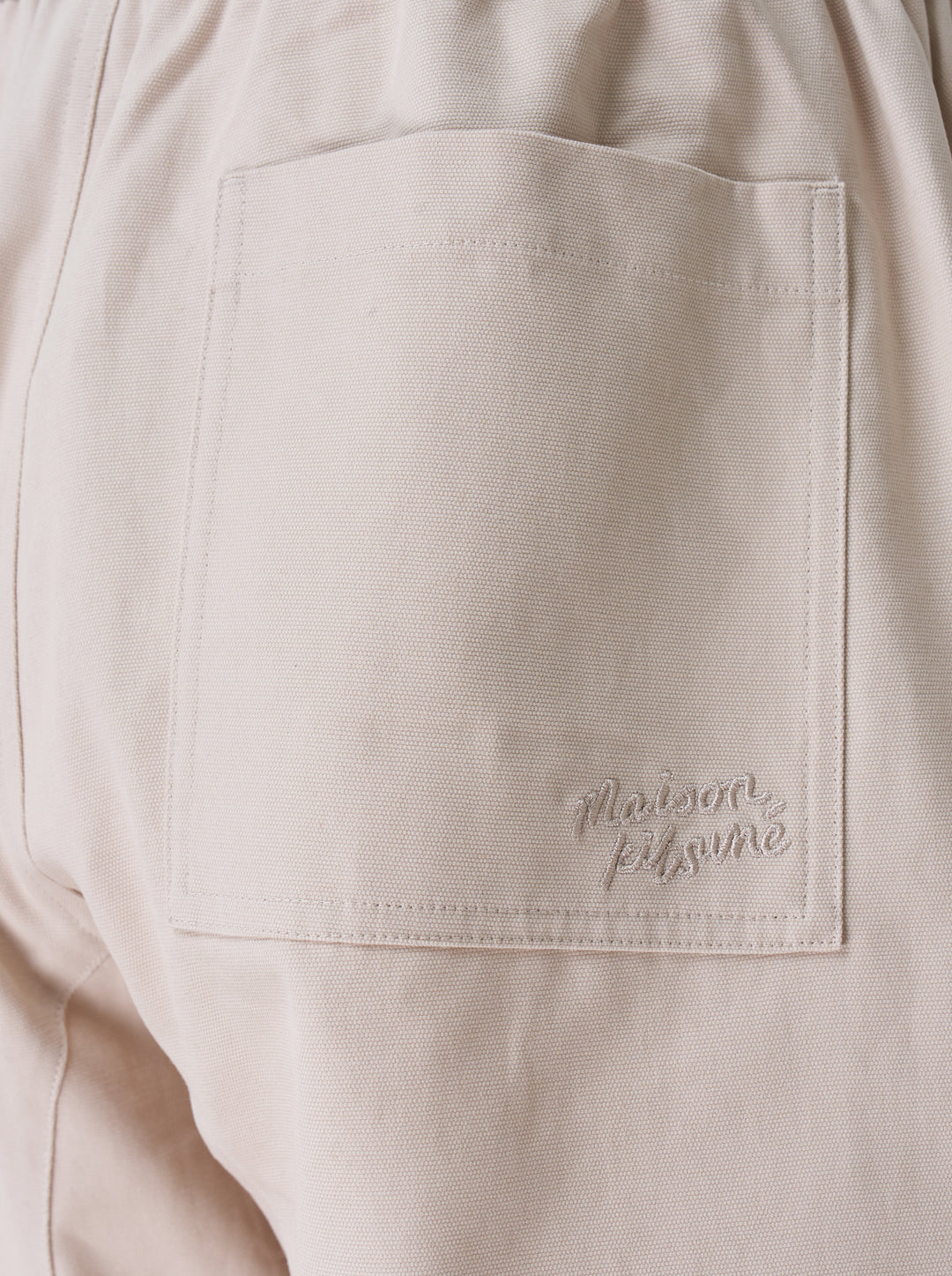 Maison Kitsuné Workwear Wide Leg Pants in blush beige with elasticated drawstring waist and front patch pockets, straight wide-leg silhouette, front view on white background - view 3