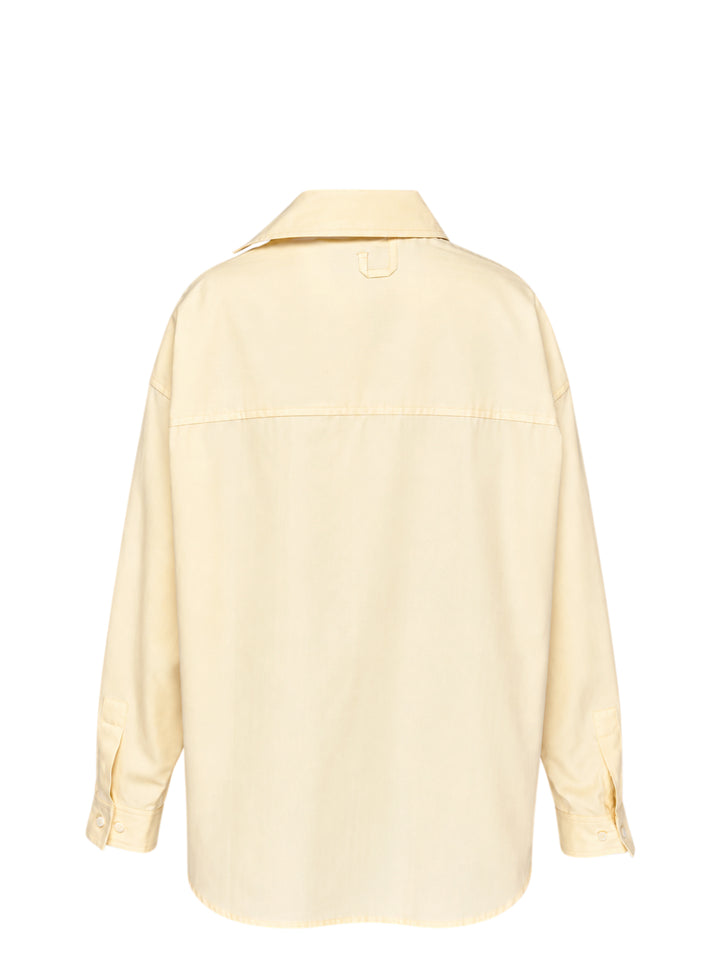 Jacquemus oversized pale yellow button-down shirt with chest patch pocket and pink script logo embroidery at the hem - view 2