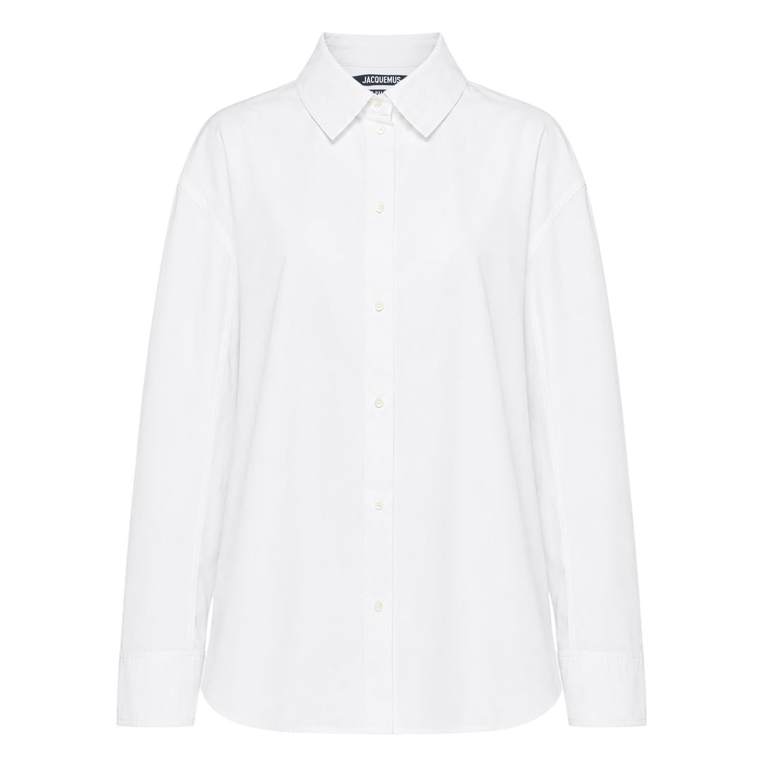 Jacquemus La Chemise Citta white woven button-down shirt with spread collar, long sleeves, and tonal buttons on a white background