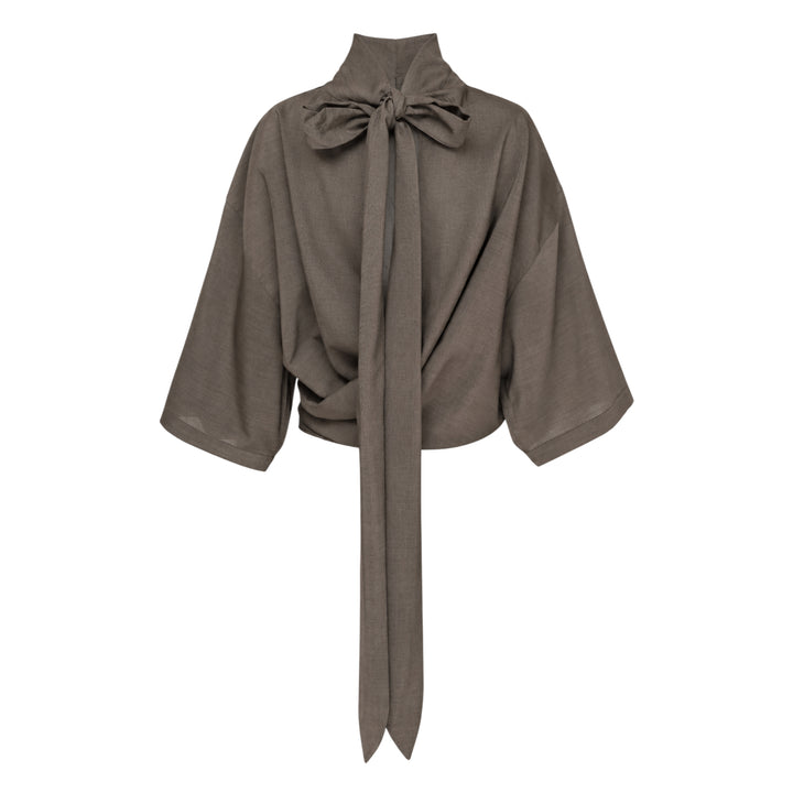 Jacquemus Havana Woven Belted Top in taupe, featuring a high turtleneck collar, wide elbow-length sleeves, and a long self-tie fabric belt at the gathered hem, displayed flat on a white background - view 2