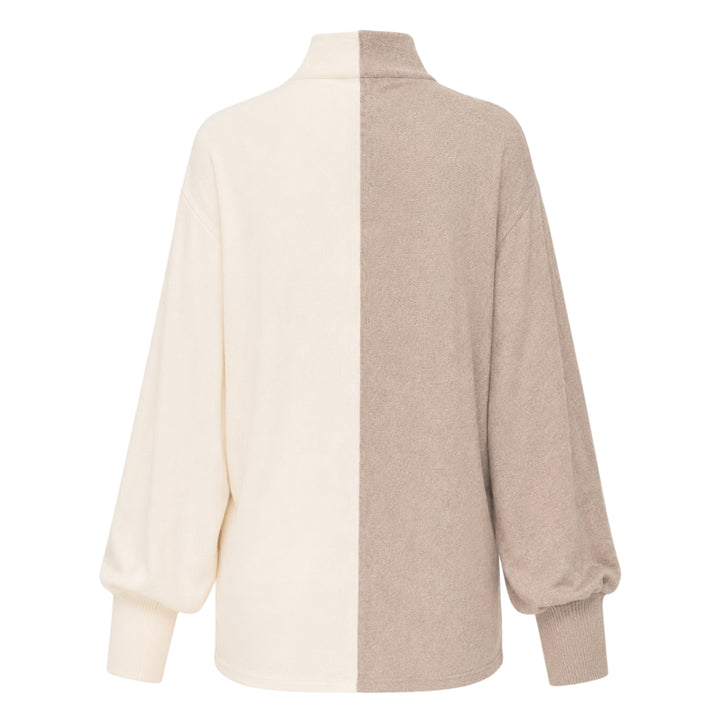 Jacquemus Losange two-tone knit top with vertical colourblock split in oat and cream, featuring a mock turtleneck collar, snap-button placket, and blouson long sleeves with ribbed cuffs - view 2