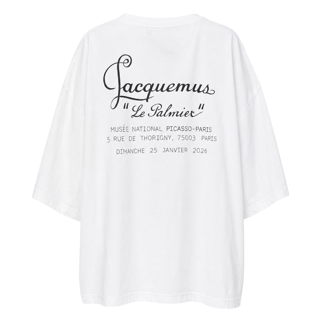 Jacquemus Le Palmier oversized white cotton tee with drop shoulders and 'Le Palmier' script embroidery at the hem, product flat lay - view 2