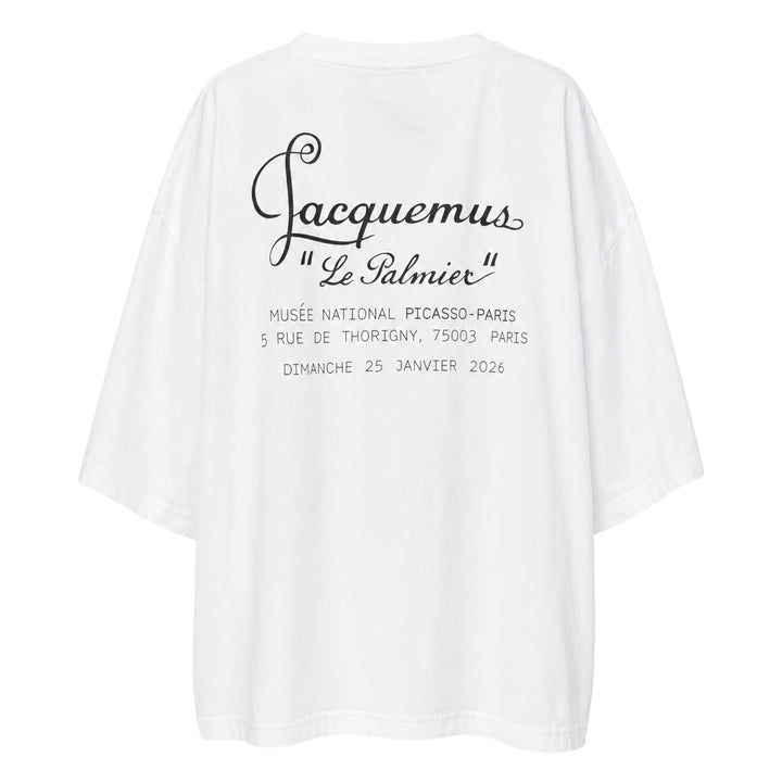 Jacquemus Le Palmier oversized white cotton tee with drop shoulders and 'Le Palmier' script embroidery at the hem, product flat lay - view 2