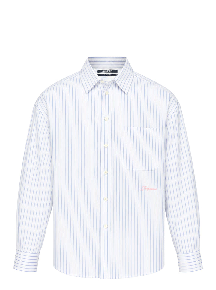 Jacquemus Cuadro long sleeve shirt in white with blue pinstripes, chest pocket and pink script logo embroidery