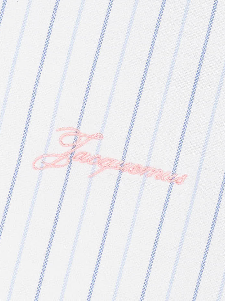 Jacquemus Cuadro long sleeve shirt in white with blue pinstripes, chest pocket and pink script logo embroidery - view 3
