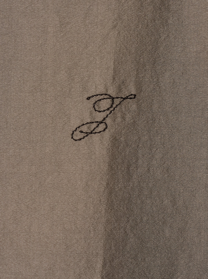 Jacquemus Simon long sleeve shirt in taupe with a lustrous crinkled finish, concealed button placket and small script embroidery at the hem - view 3