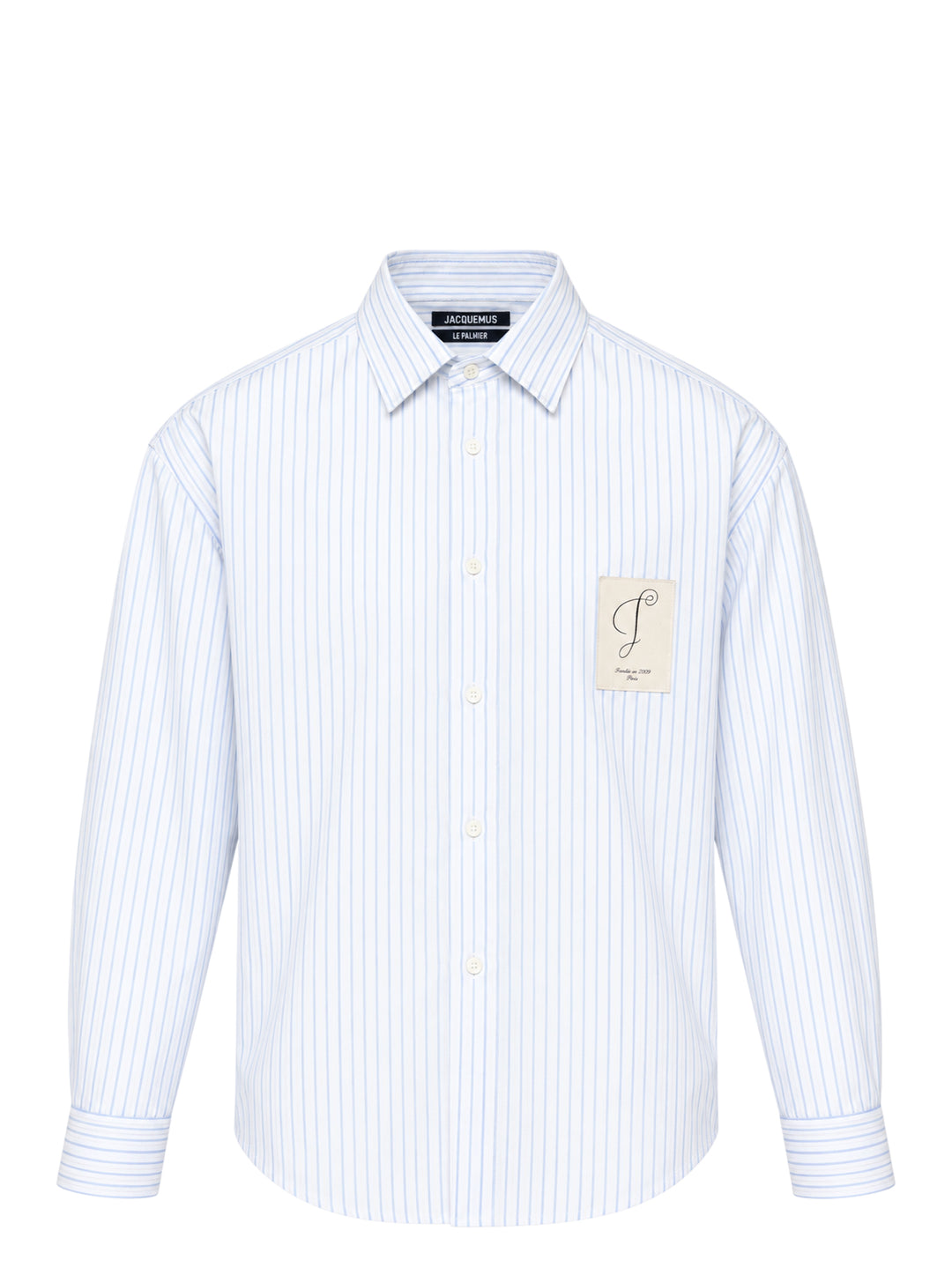 Jacquemus Simon long sleeve shirt in blue and white pinstripe with a script 'J' patch on the chest