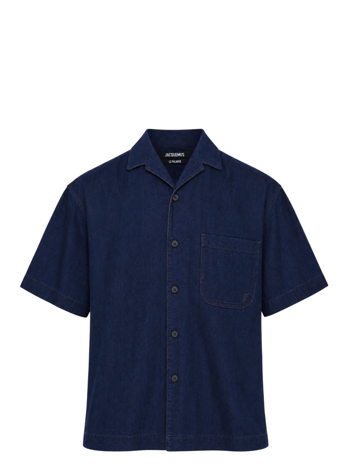 Jacquemus Denim Pyjama Shirt in dark indigo with camp collar, short sleeves, button front and embroidered chest pocket