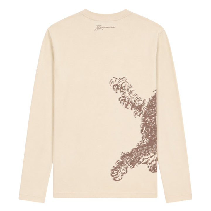 Jacquemus Le T-Shirt Bichon in ecru — long-sleeve crew-neck tee featuring a tonal brown hand-drawn curly dog illustration with a varsity number bib and cursive Jacquemus script across the front - view 2