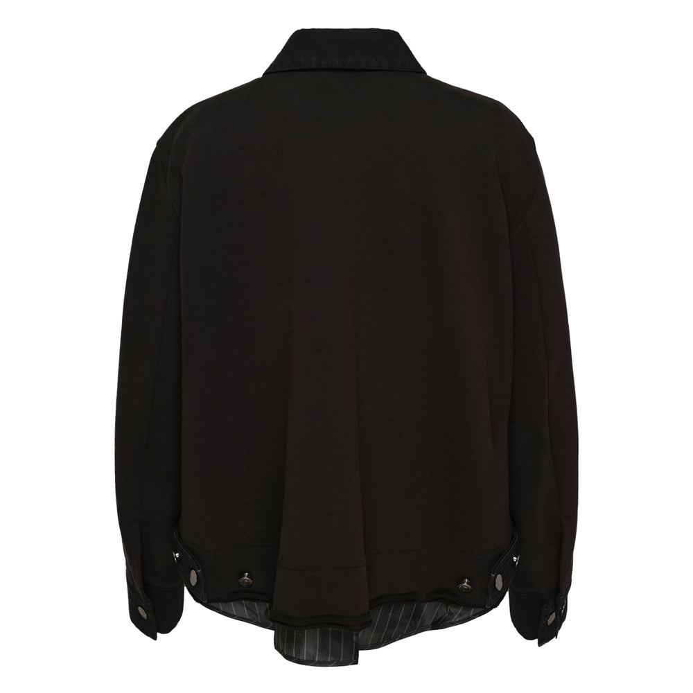 Ordinary Couture Code Broking Denim Jacket in black with silver snap buttons, chest flap pockets, and pinstripe collar lining detail, front view