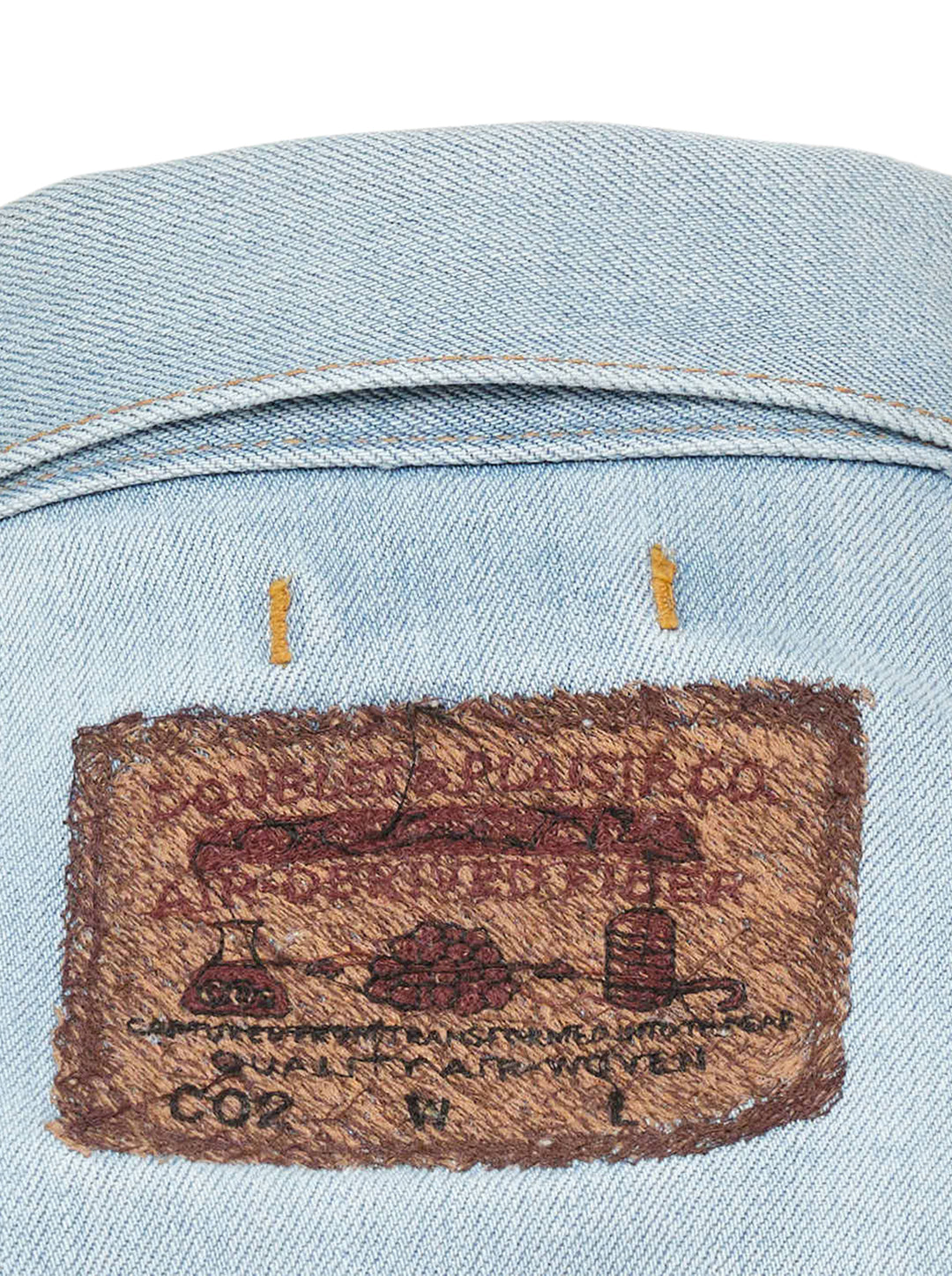 doublet Air Yarn Faded Denim Jacket in light-wash blue with archival printed patch labels on the chest pocket and cuff, featuring amber topstitching and gunmetal button fastening - view 5