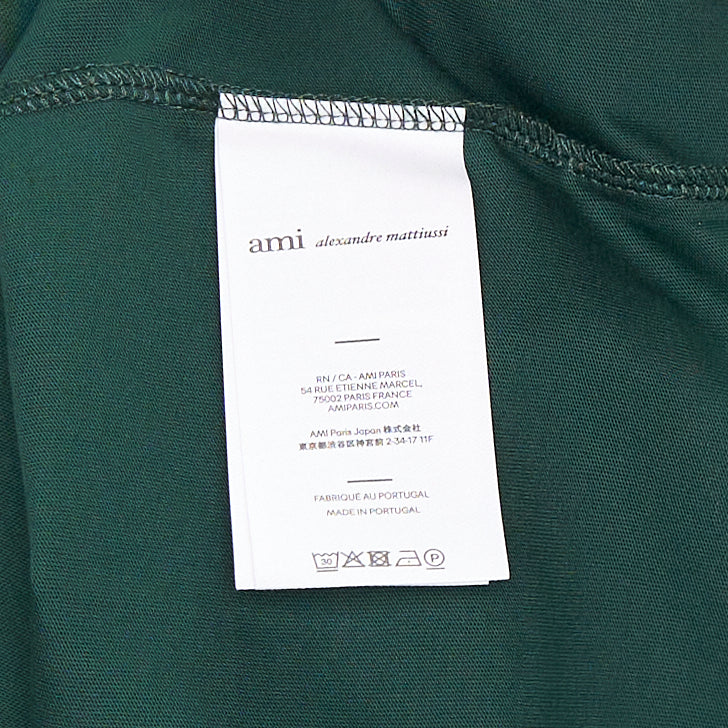 AMI Alexandre Mattiussi forest green cotton crew-neck tee with tonal Ami de Cœur logo embroidery on the chest and woven label at the collar