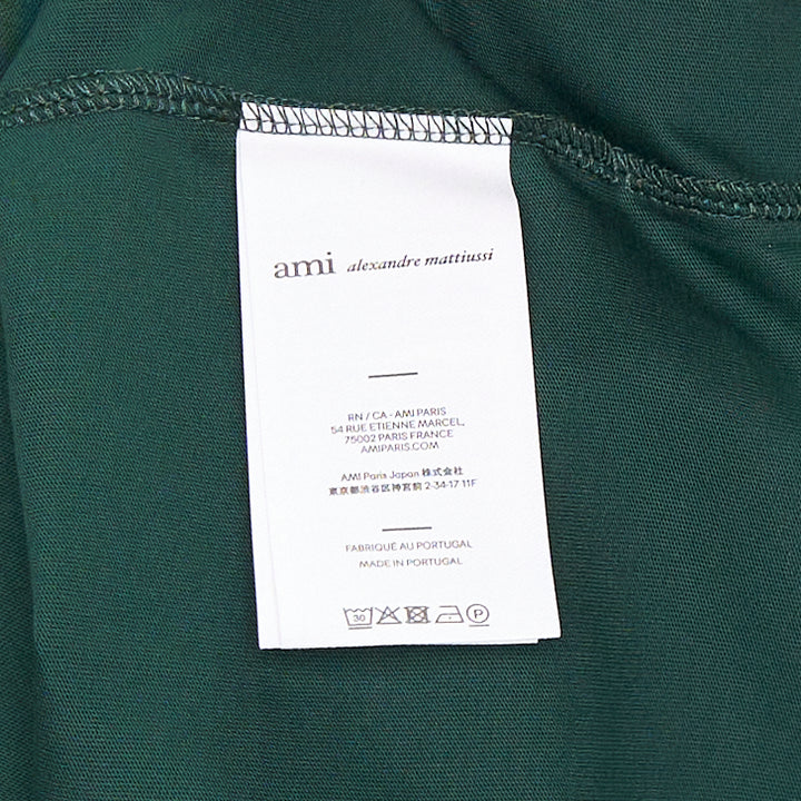 AMI Alexandre Mattiussi forest green cotton crew-neck tee with tonal Ami de Cœur logo embroidery on the chest and woven label at the collar