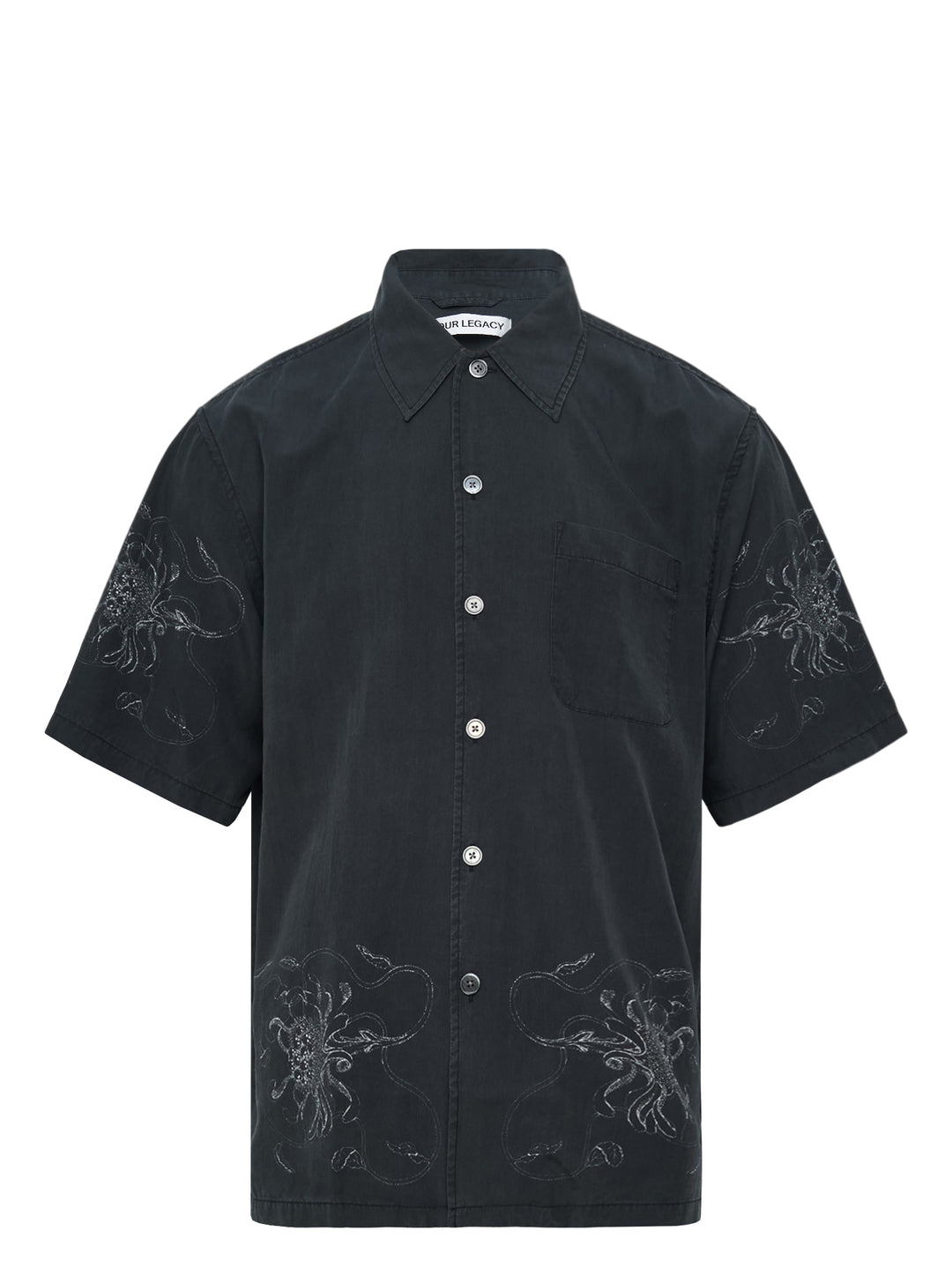 Our Legacy Every Short Sleeve Shirt in washed black with tonal floral embroidery on both sleeves and lower hem, featuring a boxy fit and pearlescent button fastening