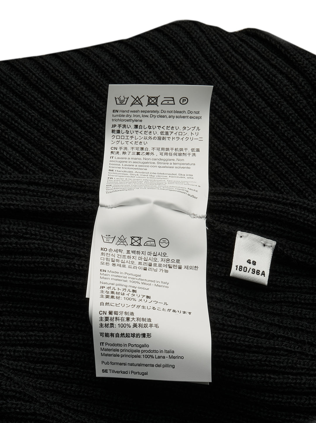 Our Legacy Compact Round Neck ribbed knit sweater in black with mock neck collar and long sleeves, front view on white background - view 3