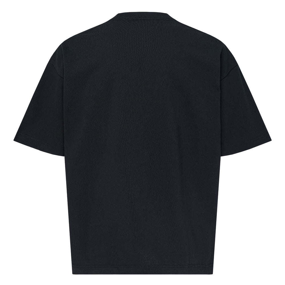 Mihara Yasuhiro Heavy Weight Jersey Short Sleeve Pocket Tee in black, featuring a boxy oversized fit, chest patch pocket, and an exposed garment label stitched to the lower front hem - view 2