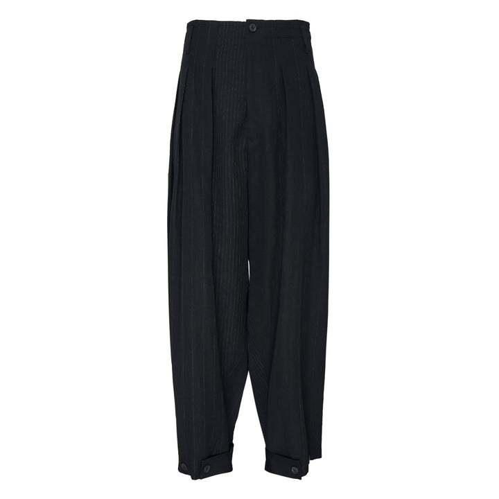 Yohji Yamamoto Hem Tab Wide Tuck Pants in black pinstripe, featuring a high-rise waistband, deep forward pleats, voluminous wide-leg silhouette, and buttoned cuff tab detailing at the hem
