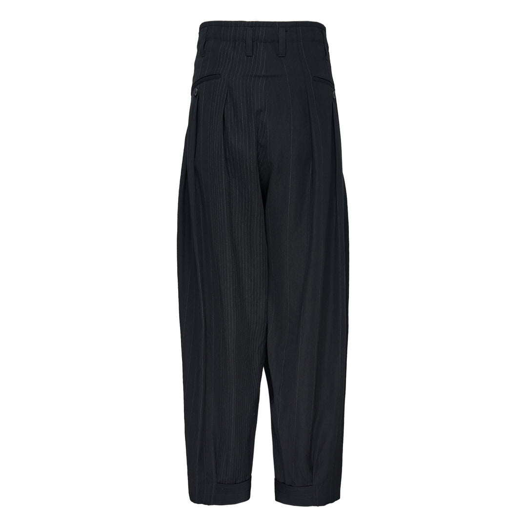Yohji Yamamoto Hem Tab Wide Tuck Pants in black pinstripe, featuring a high-rise waistband, deep forward pleats, voluminous wide-leg silhouette, and buttoned cuff tab detailing at the hem - view 2