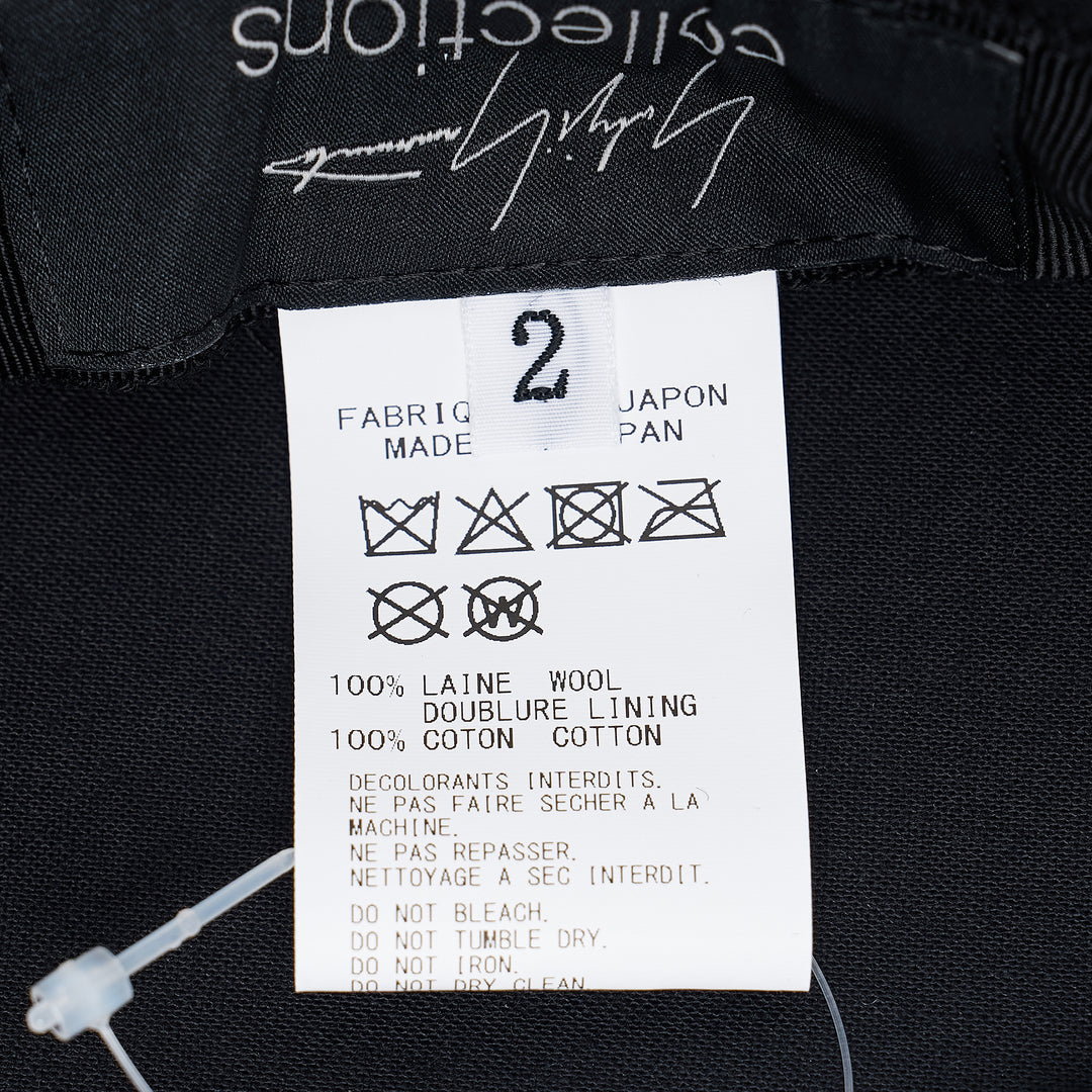 Yohji Yamamoto black bucket beret hat with oversized rounded crown, tonal seam detailing, and a flat structured peaked brim, shown on a white background - view 3