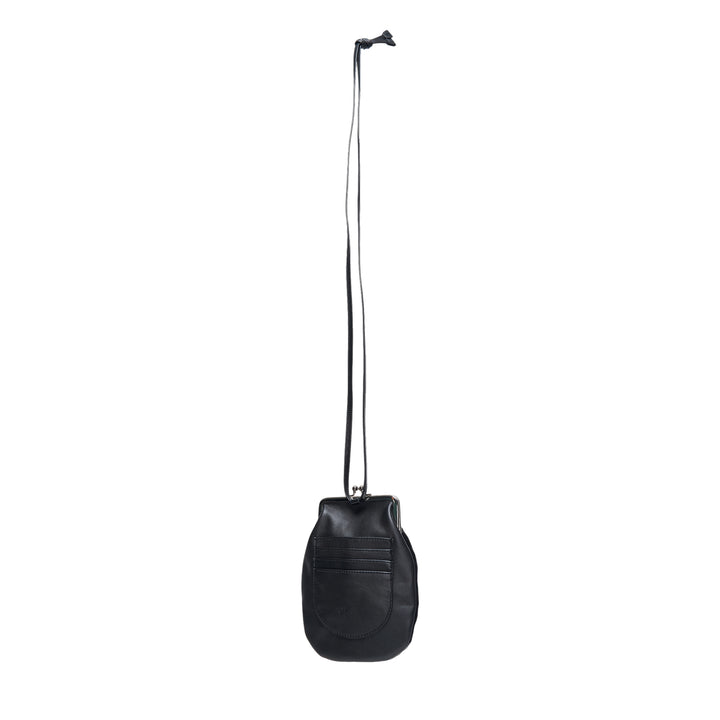 Y's black tonal argyle leather and suede patchwork mini pouch with silver-tone kiss-lock clasp, suspended from a long slender leather necklace cord against a white background