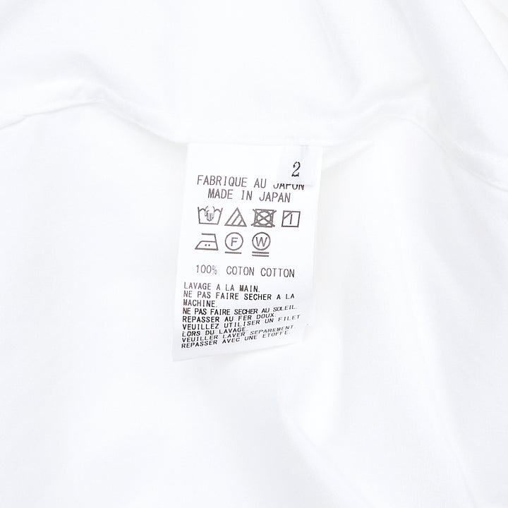 Y's U-Sailor Collar Shirt in white, featuring an oversized dramatic U-shaped sailor collar, concealed front placket, single chest patch pocket, and long sleeves with buttoned cuffs
