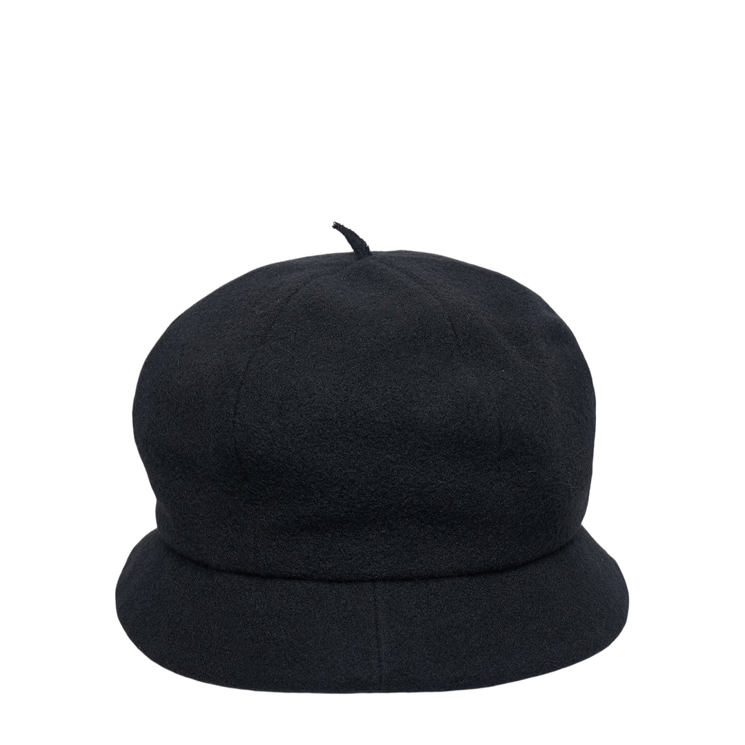 Y's black wool beret cap with a rounded dome crown, small fabric pip at the apex, and a soft downward-curved unstructured brim, photographed on a white background - view 2