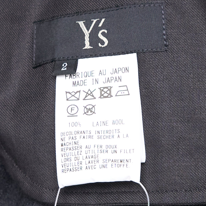 Y's black relaxed-fit drawstring joggers with drop-crotch silhouette, elasticated high-rise waistband with tonal tie, and gathered ankle cuffs, displayed flat on a white background