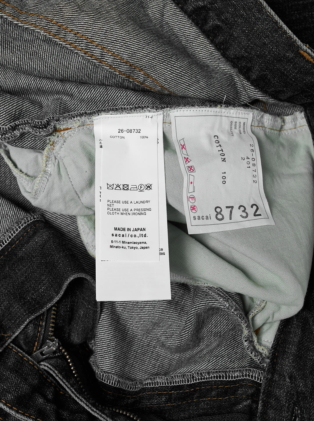sacai belted wide-leg barrel jeans in washed black denim with deep front pleats, contrast stitching, and tapered hem, photographed flat on white background - view 3
