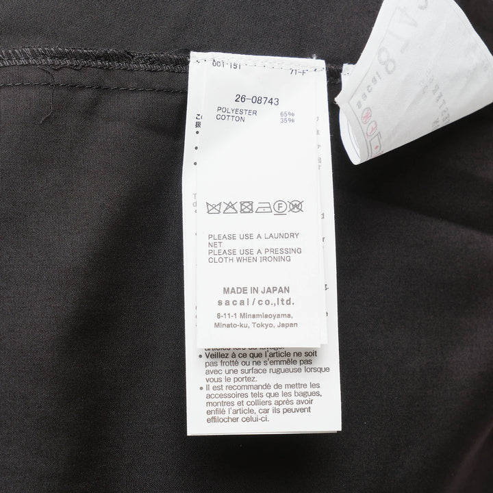 sacai Wide Sleeve Poplin Shirt in black, featuring a concealed button placket, point collar, flared long sleeves with deep cuffs, a chest patch pocket, and twin lower patch pockets - view 3