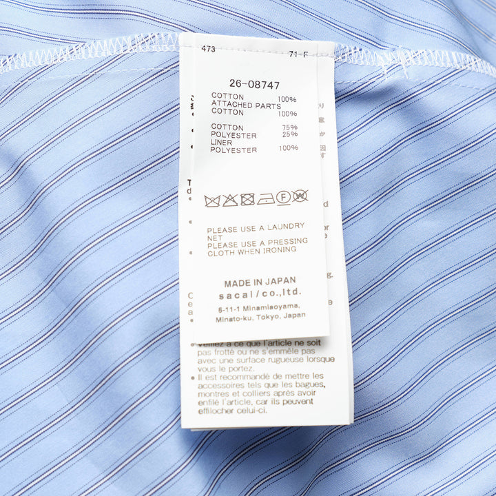 sacai Poplin x Cotton Jersey T-Shirt in black, featuring a crew neck, chest pocket, and light blue pinstripe poplin side panels with a flared hem - view 3