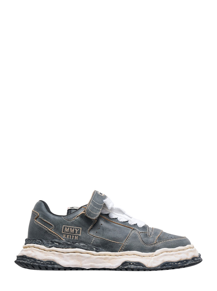 Mihara Yasuhiro Keith low-top sneaker in overdyed grey leather with distressed layered sole, strap closure and oversized white laces, side view