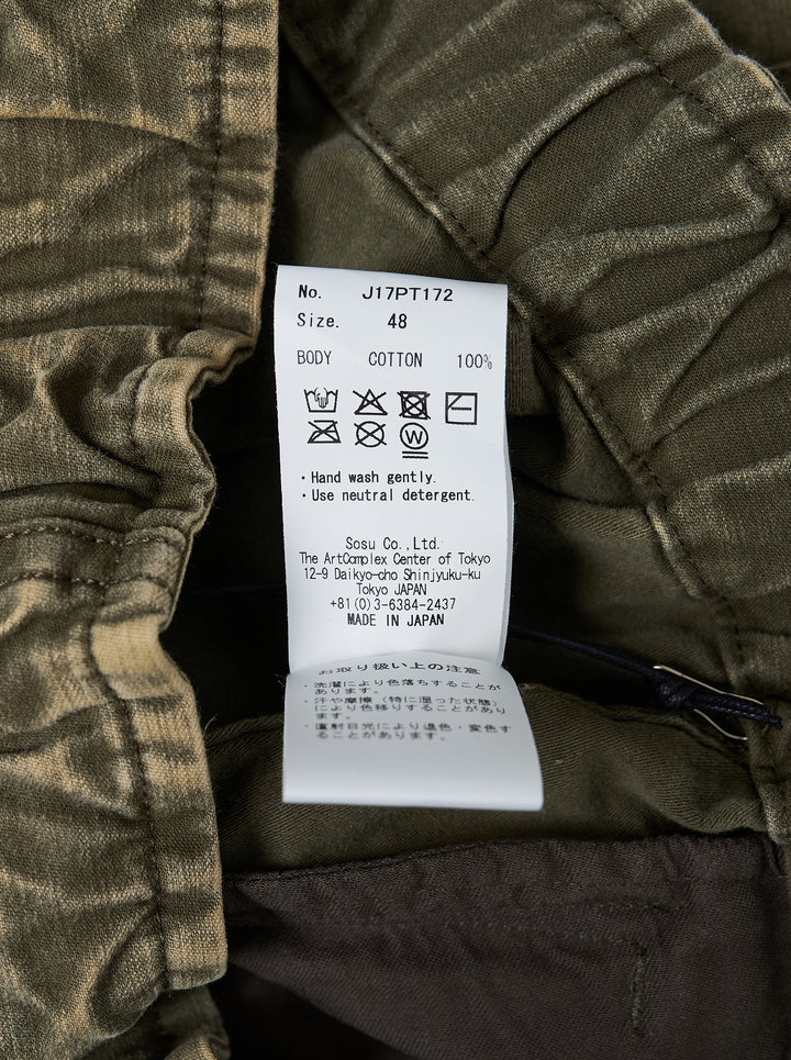 Mihara Yasuhiro washed olive damaged cargo pants with drawstring waist, oversized cargo pockets and distressed finish, front view - view 4
