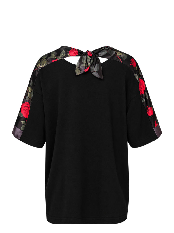 Undercover Floral Sleeve Panel Tee in black with rose-print satin sleeve panels, chest pocket and knotted satin tie at the back neckline - view 2