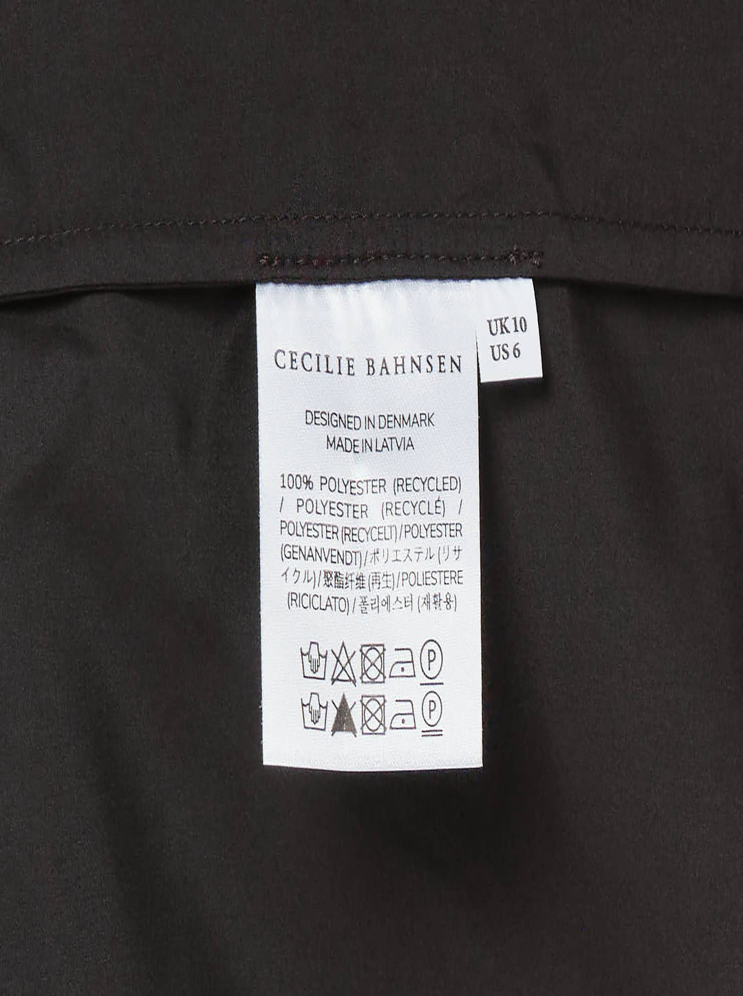 Cecilie Bahnsen Recycled Faille Midi Dress in deep espresso brown, sleeveless with a round neckline, relaxed cocoon silhouette, and curved hem, shown on a white background - view 3