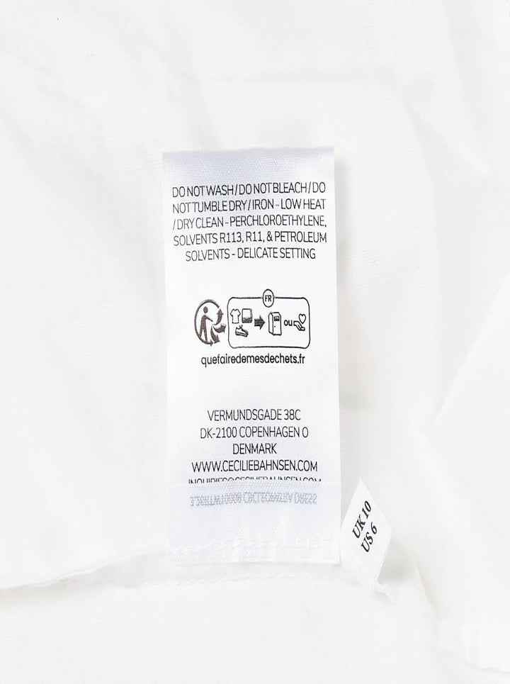 Cecilie Bahnsen Floratini Matelassé Midi Skirt in white, displayed flat, showing a voluminous A-line silhouette with an all-over raised jacquard texture and elasticated waistband - view 4