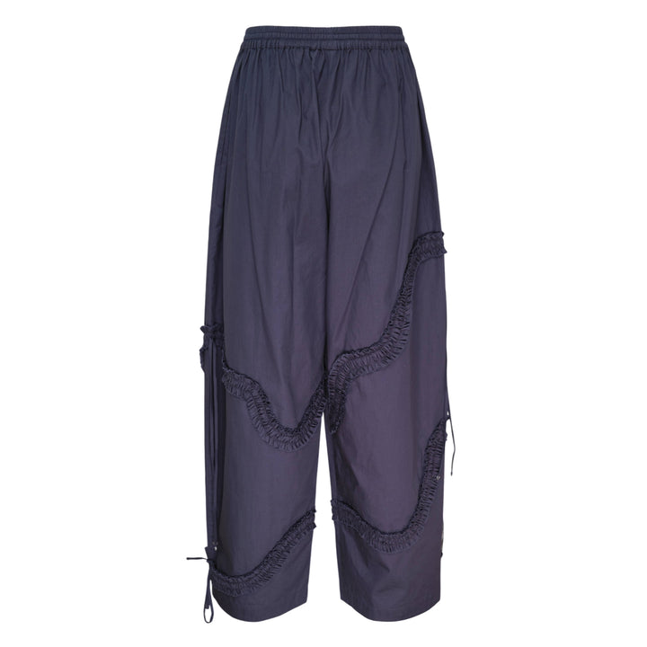 Hisu Park Ruffle Drawstring Trousers in navy, featuring wide barrel-leg silhouette with curved gathered ruffle seams and satin ribbon ties across both legs, elasticated drawstring waistband - view 2
