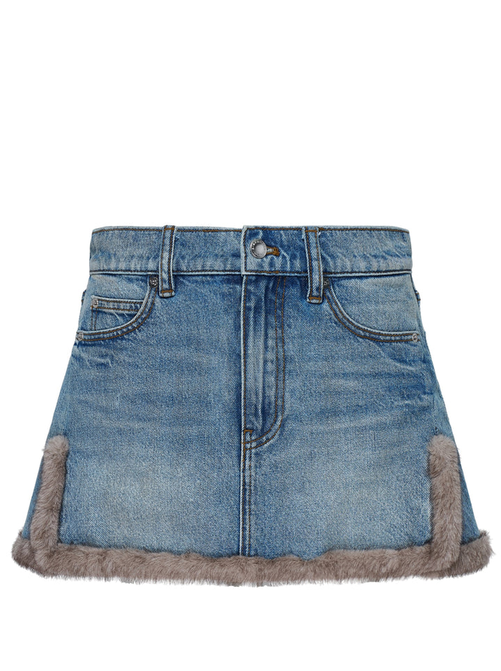 Alexander Wang washed blue denim mini skirt with faux mink trim along the hem and side vents, shown from the front