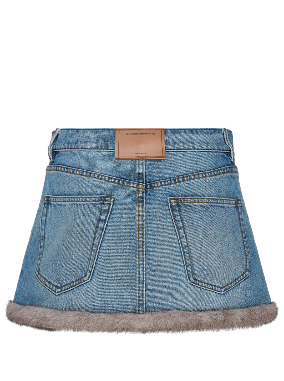 Alexander Wang washed blue denim mini skirt with faux mink trim along the hem and side vents, shown from the front - view 2