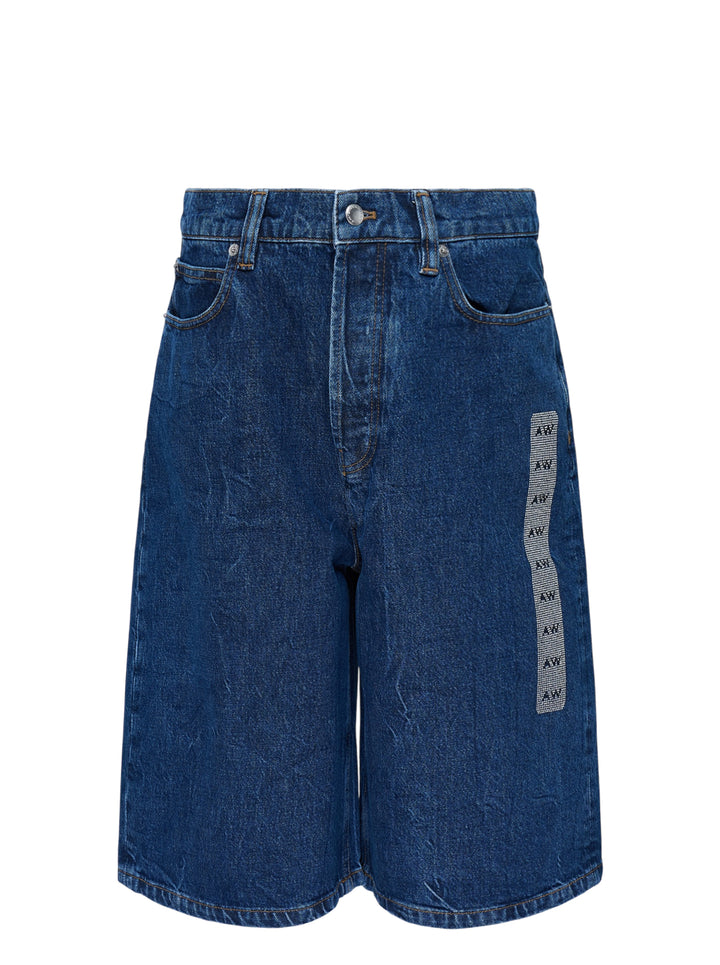 Alexander Wang low rise indigo denim board shorts with button fly and crystal-embellished AW logo strip