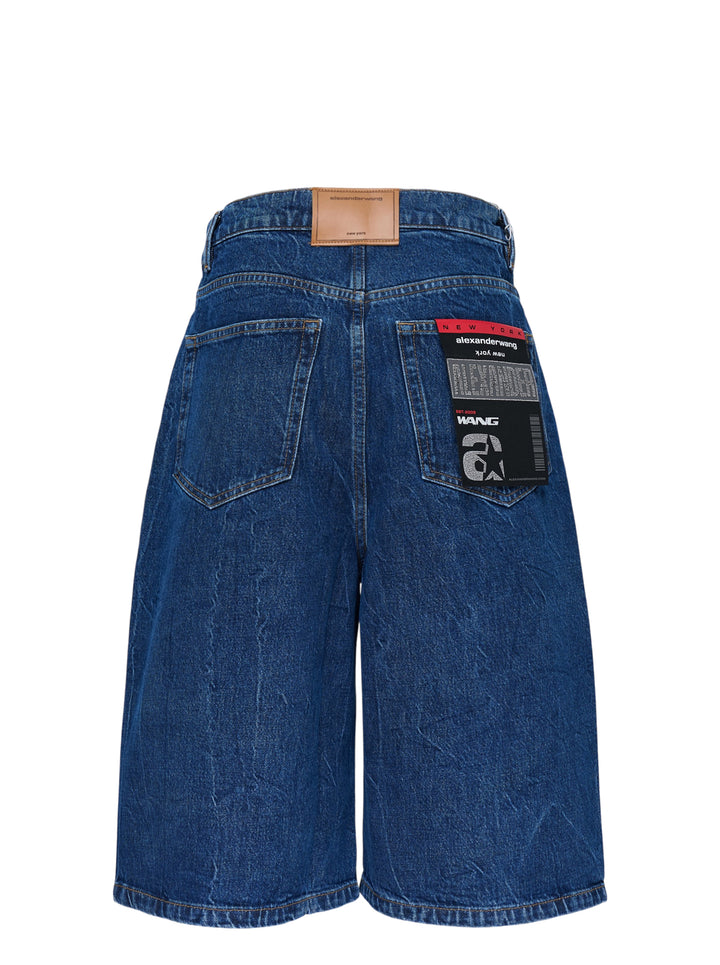 Alexander Wang low rise indigo denim board shorts with button fly and crystal-embellished AW logo strip - view 3