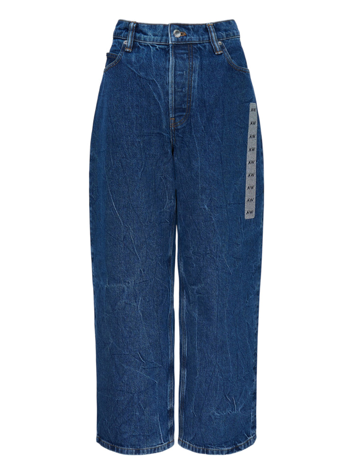 Alexander Wang unisex wide-leg jeans in crinkled mid-blue denim with a woven AW monogram flasher at the hip