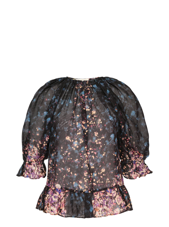 Ulla Johnson Elise short sleeve silk blouse in a dark-ground painterly floral print with voluminous puff sleeves, smocked ruffle cuffs, and a tiered ruffle hem
