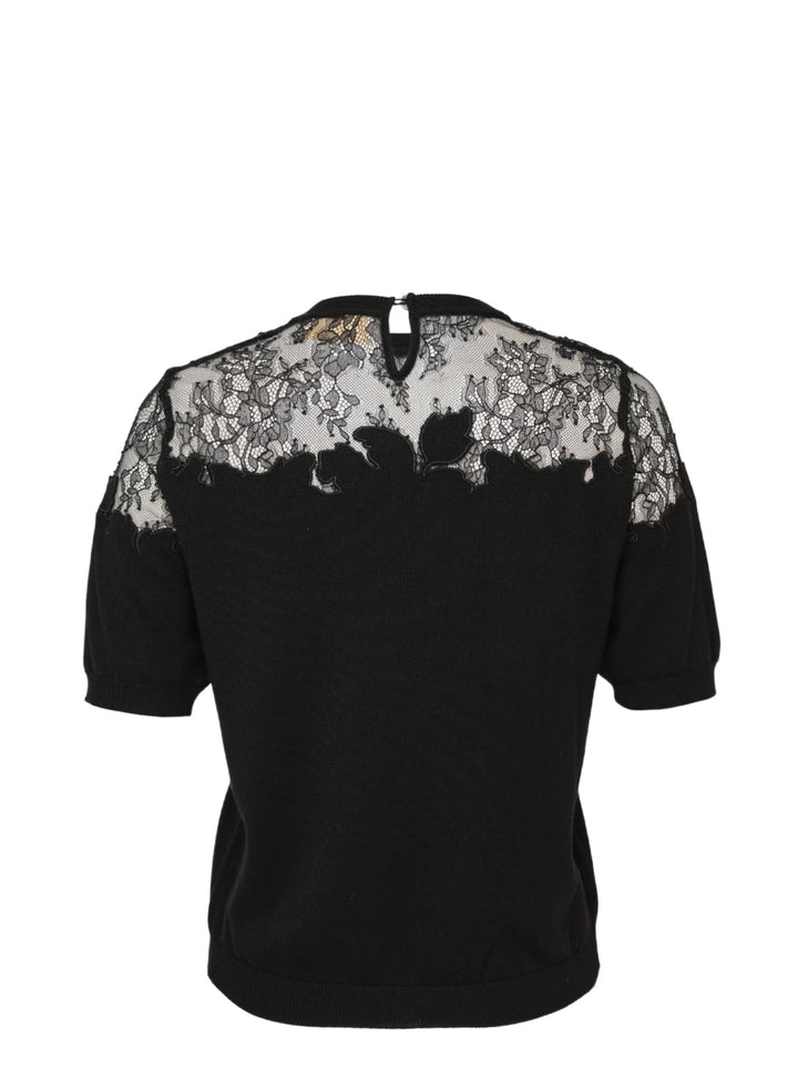Ulla Johnson Ella Short Sleeve Lace Top in black, featuring a sheer floral embroidered lace yoke, puffed short sleeves, and a fine-knit body with keyhole back closure - view 2
