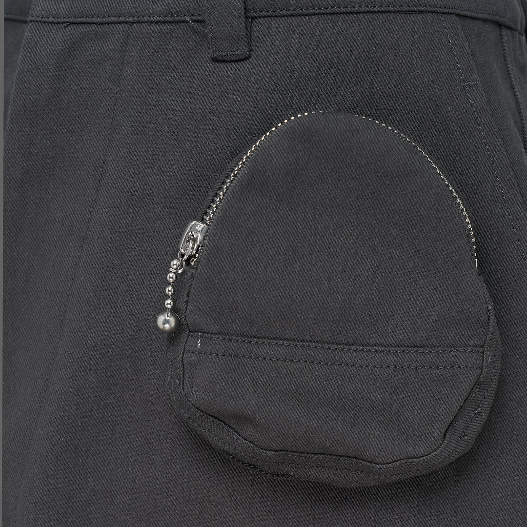 Melitta Baumeister charcoal wide-leg cargo culottes with high waist, sculptural rounded zip utility pocket, and A-line silhouette, shot flat on white background