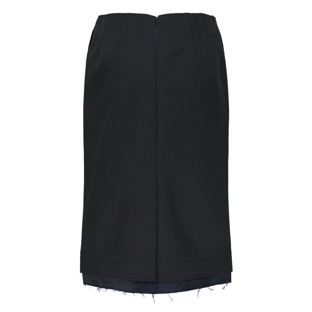 RE;CODE Slit H-Line Skirt in black, featuring a slim pencil silhouette, front slit with layered underlap, raw-fringed waistband, and woven brand label