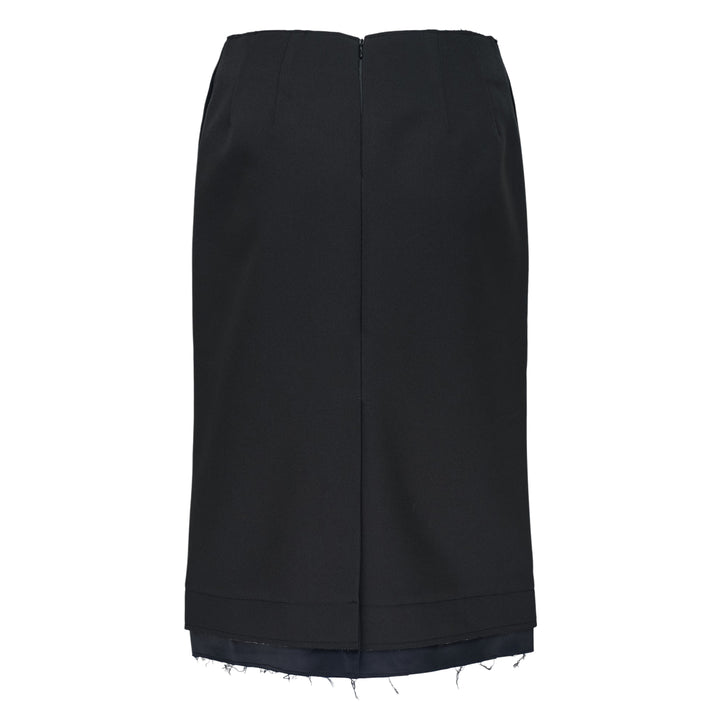 RE;CODE Slit H-Line Skirt in black, featuring a slim pencil silhouette, front slit with layered underlap, raw-fringed waistband, and woven brand label