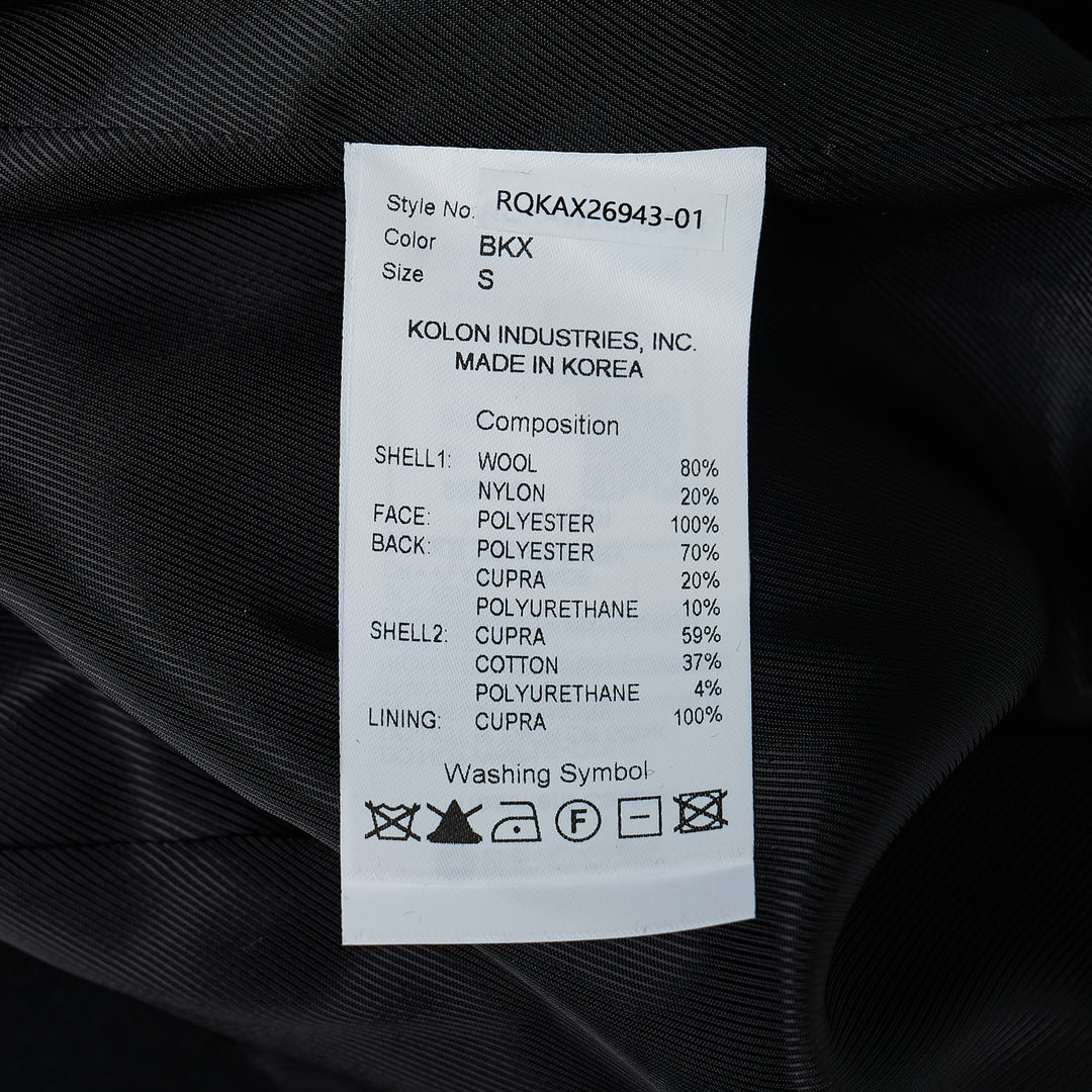 RE;CODE Slit H-Line Skirt in black, featuring a slim pencil silhouette, front slit with layered underlap, raw-fringed waistband, and woven brand label