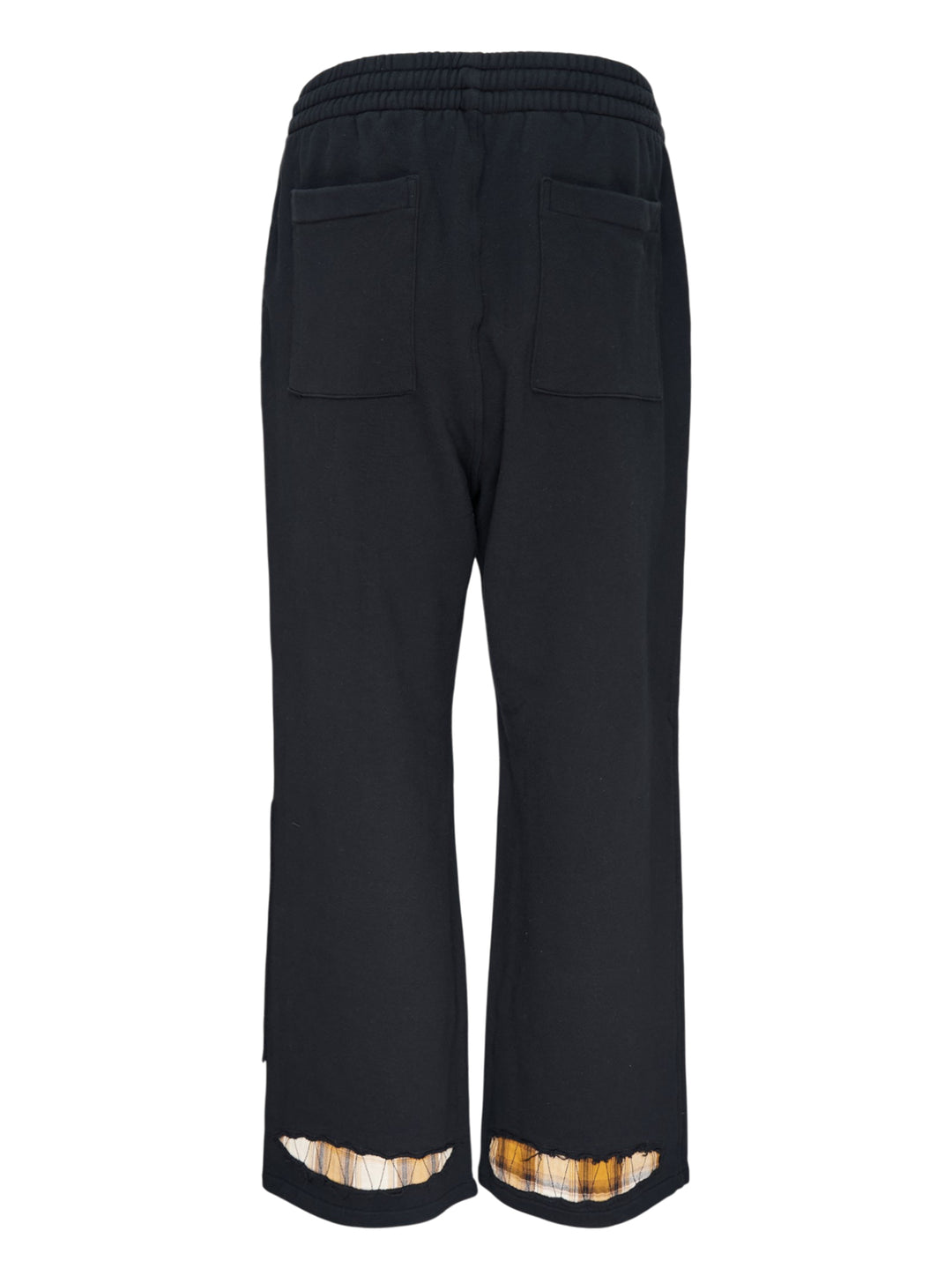 We11done Black Repaired Sweatpants with amber tartan plaid knee patch and embroidered logo, wide-leg relaxed fit, elasticated waistband, front view on white background - view 2