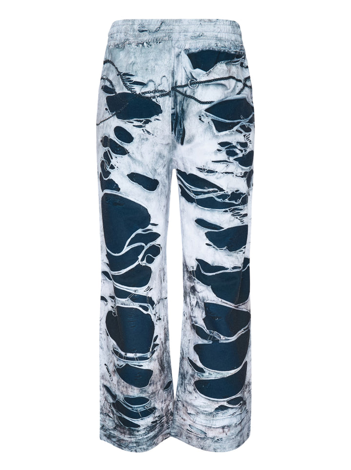 We11done Vintage Printed Sweatpants in light grey, back view, featuring an allover trompe-l'œil print of heavy distressing, chain hardware, and exposed dark denim layers on a wide-leg silhouette - view 2