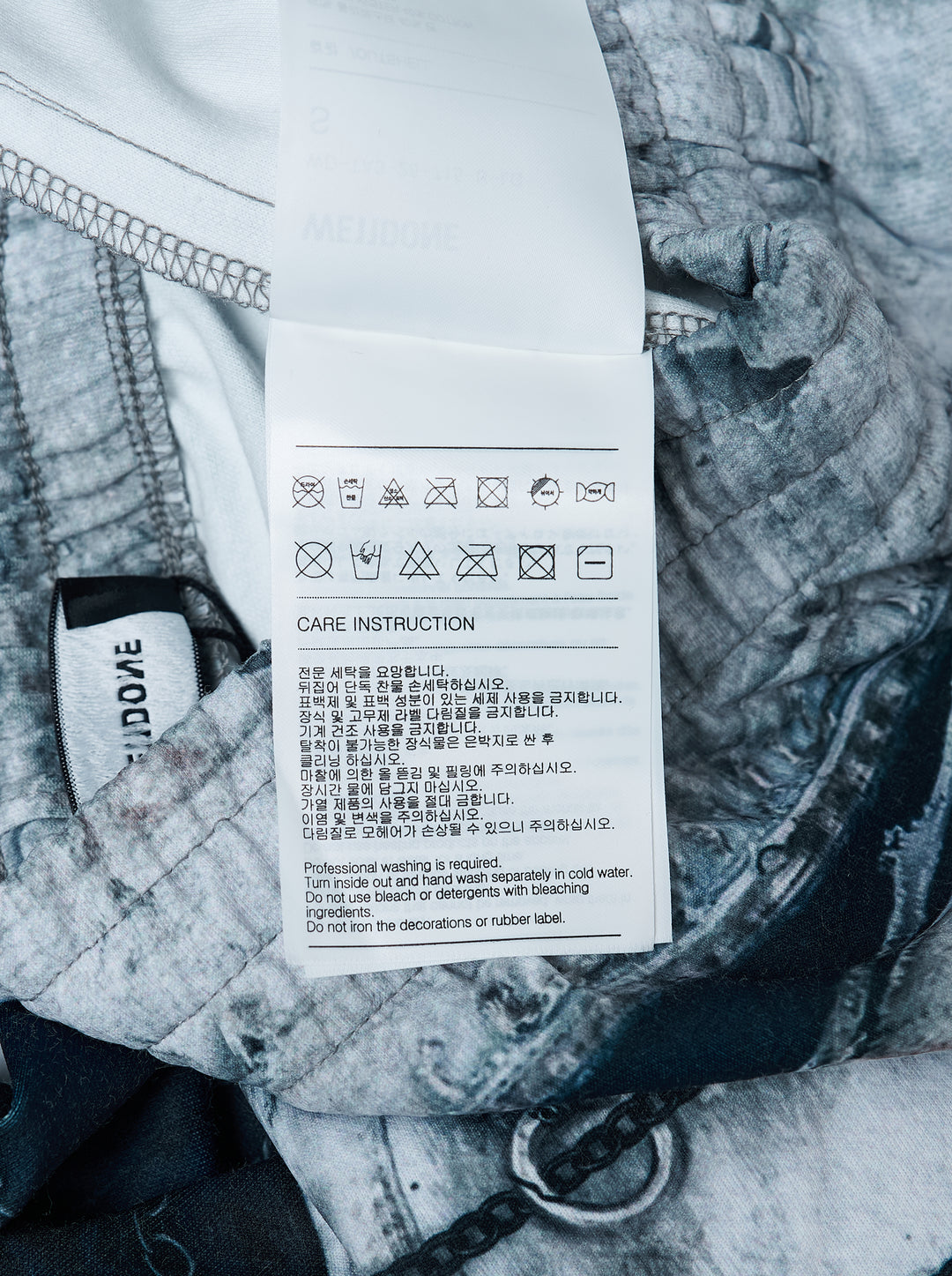 We11done Vintage Printed Sweatpants in light grey, back view, featuring an allover trompe-l'œil print of heavy distressing, chain hardware, and exposed dark denim layers on a wide-leg silhouette - view 3
